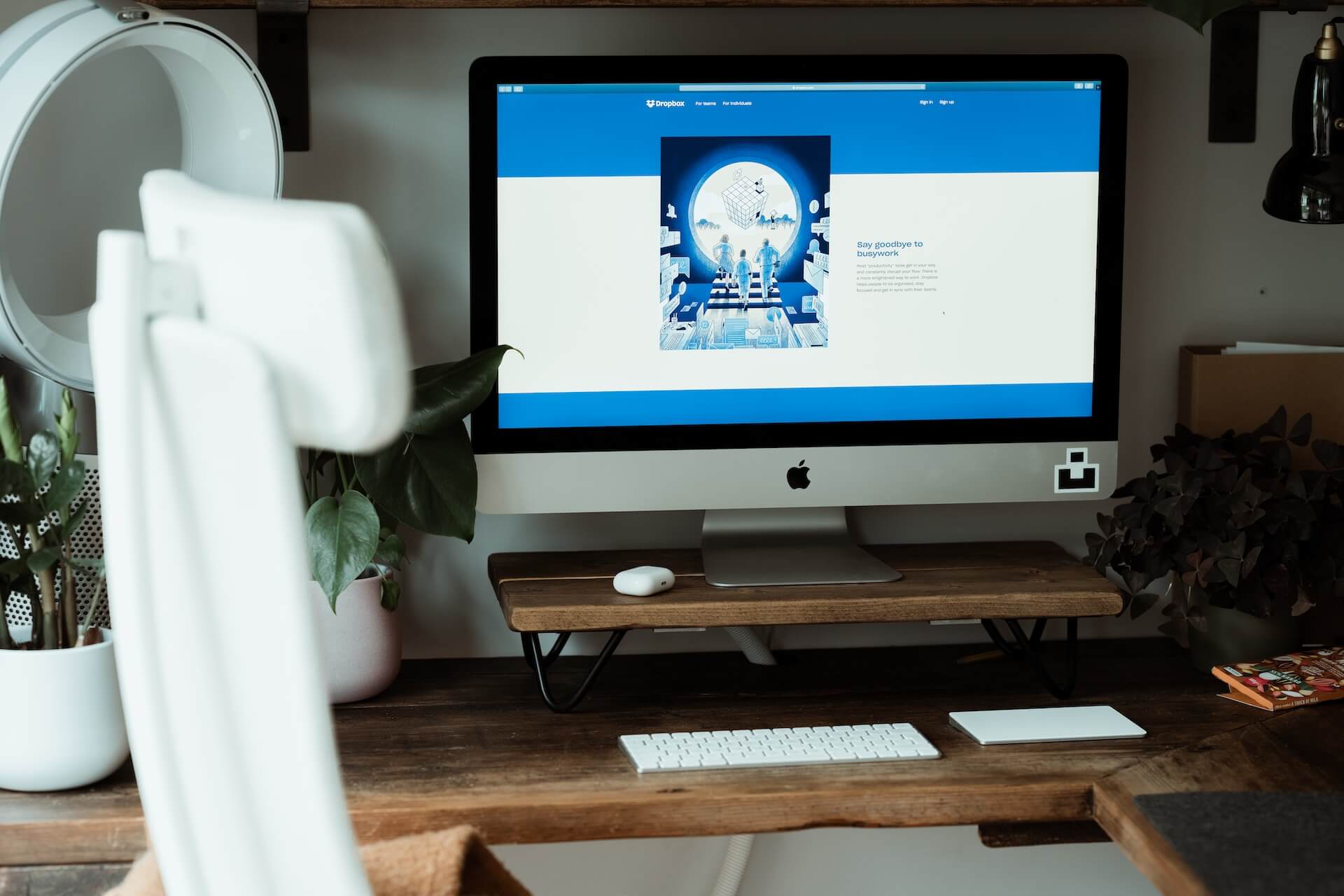 Computer screen on a desk showing the Dropbox platform