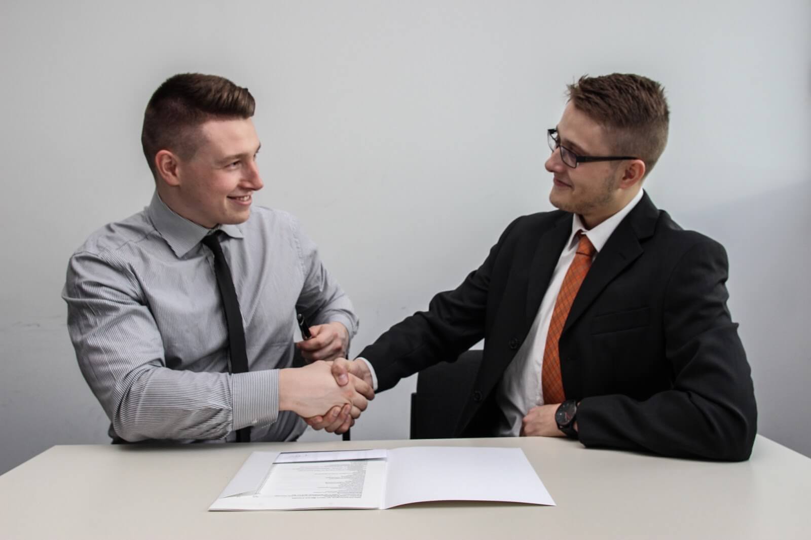 Two business men shaking hands 